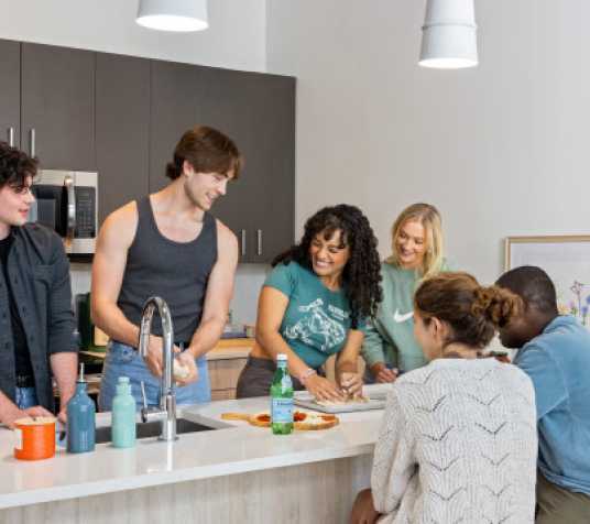 Friends cooking in a kitchen